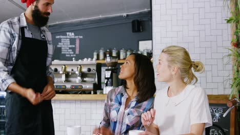 waiter serving coffee to customer