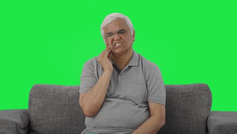 Sick-Indian-old-man-suffering-from-tooth-pain-Green-screen