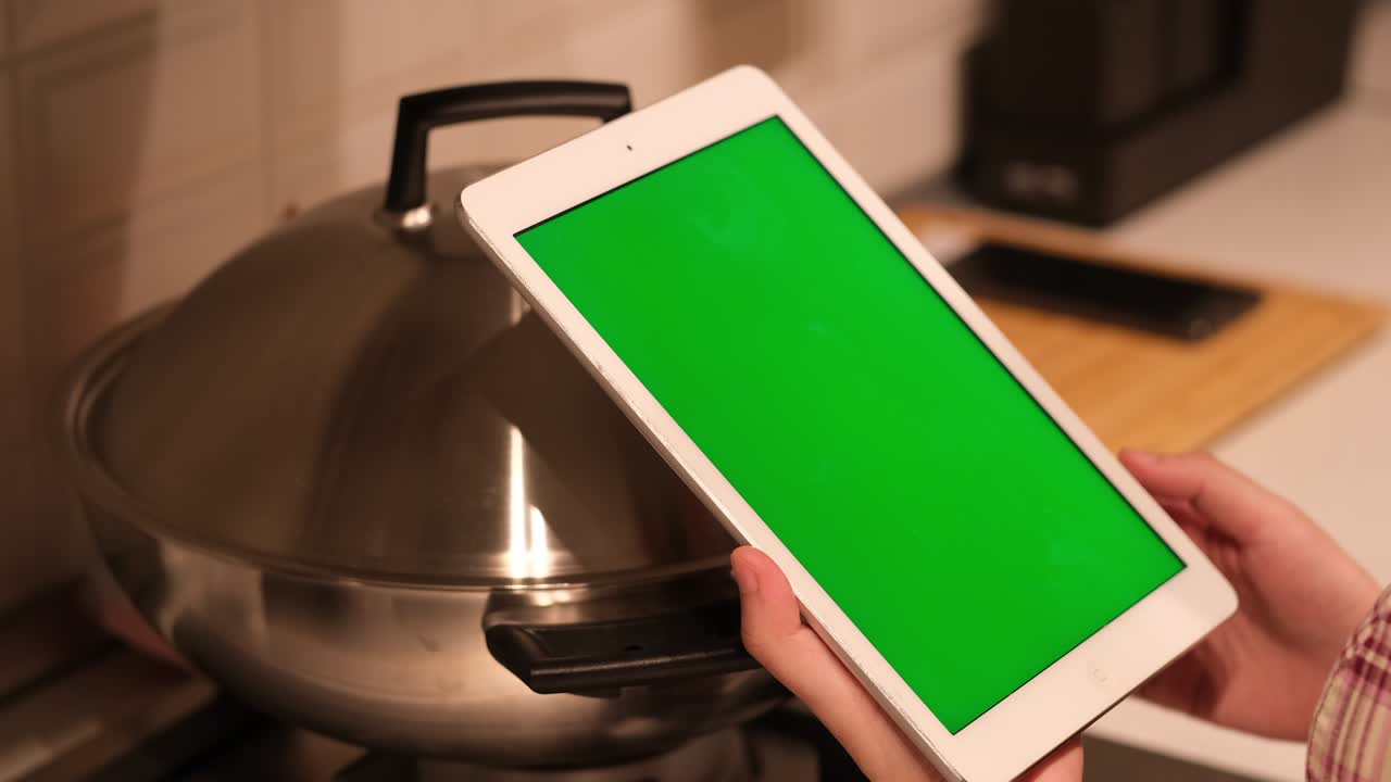 people using green screen tablet while cooking