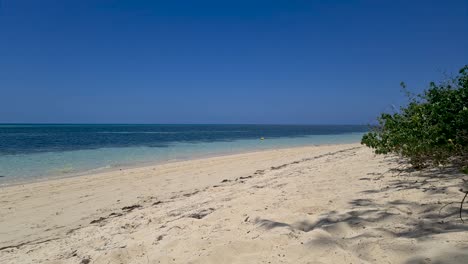 calm ocean waves breaking on sandy beach