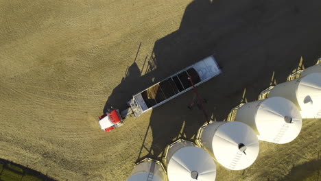top down view of grain truck at the distribution silos