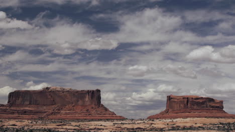 time lapse shot of clouds over monument valley