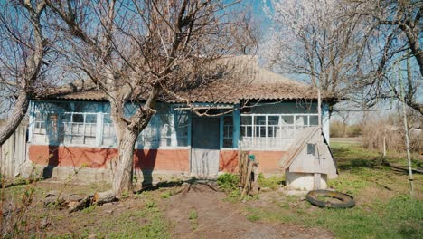 steadicam shot: an old abandoned house in a ukrainian village. locked