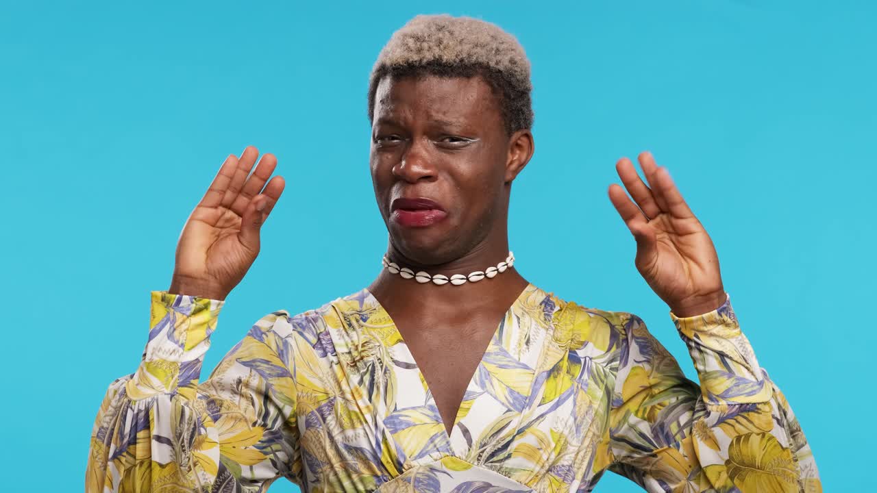 Funny black transgender woman showing babble gesture