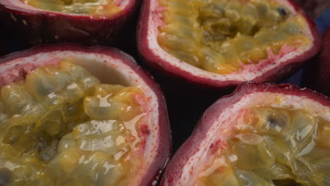 rotating passion fruits close up, juicy tropical maracuya, exotic fruit, 4k macro shot