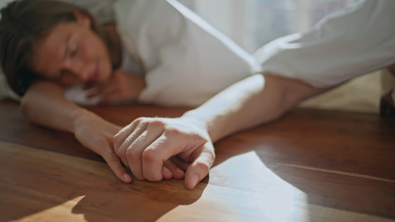 Romantic lovers holding hands enjoying serene time together. Affectionate couple