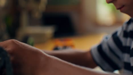 young boy focused on a toy