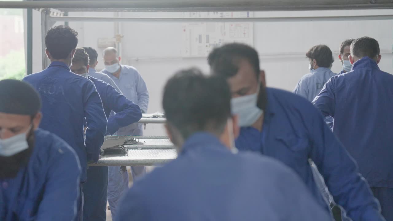 Factory Workers in a Manufacturing Plant