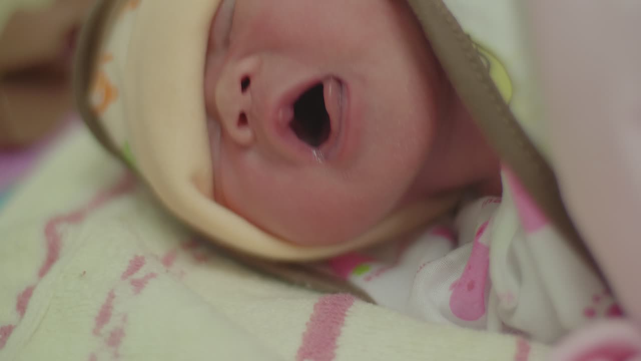 Yawning Newborn Baby
