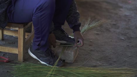 Close-up-shot-of-the-hands-and-feet-of-a-man-in-Tucumán,-Argentina,-making-crafts-with-skill,-showing-traditional-crafts-and-cultural-heritage