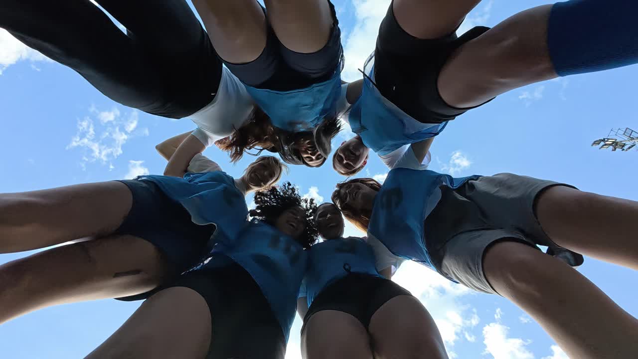 Team Huddle Under Blue Sky