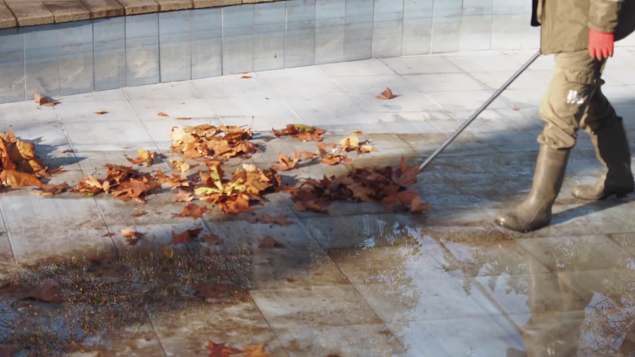 Sweeping Leaves from a Patio