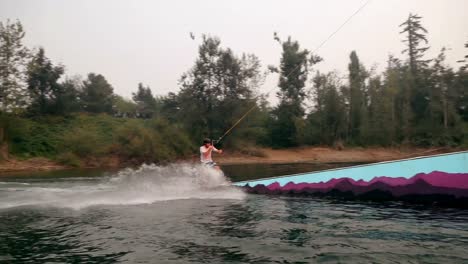 man wakeboarding in the river 4k