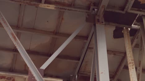 Industrial-silos-from-yesteryears-adorned-with-metal-ladders,-embodying-the-essence-of-industrial-legacy-and-urban-exploration