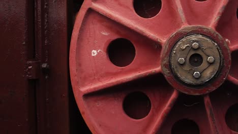 close-up of a red industrial pulley wheel