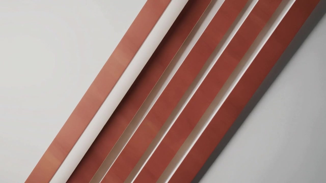 Starting motion, five brown slats sliding on diagonal across studio wall, showing seams and shadows