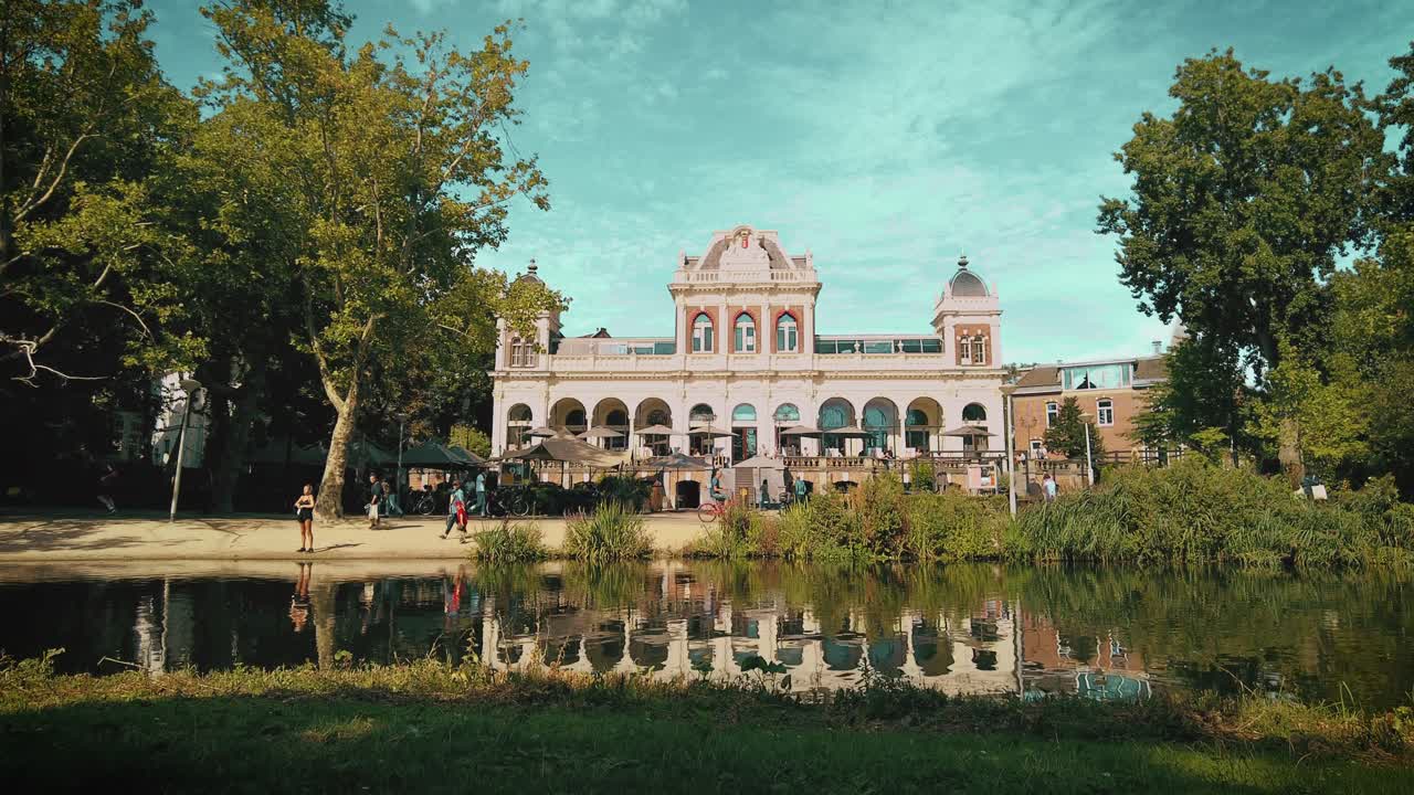 wide shot jib dutch Vondel Media Culture LAB building AVROTROS Amsterdam at pond