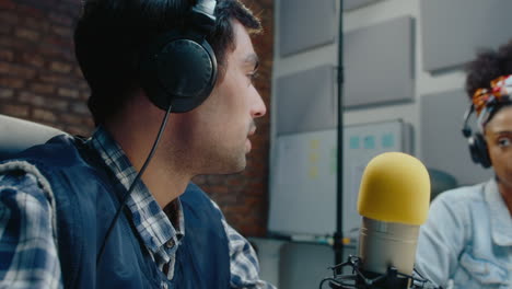 radio show hosts in a studio