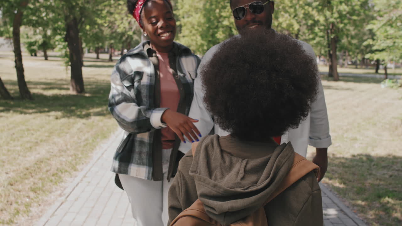 African-American Boy on Summer Walk with Parents