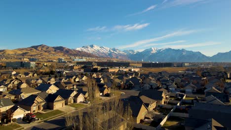 low altitude flight over a suburban neighborhood towards silicon slope in lehi, utah