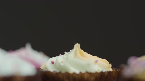 Close-Up-Shot-of-Cupcakes-Orbiting-Around-Central-Rotating-Cupcake