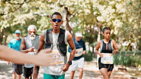 elderly runners receiving encouragement