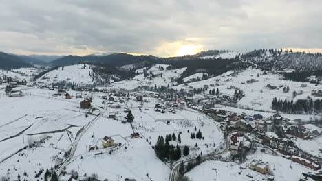 snow-covered cottages in a ski resort. olympic village. aerial view