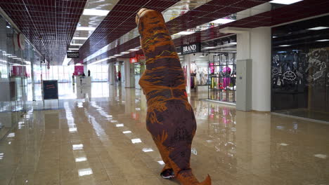 inflatable dinosaur in an empty shopping mall