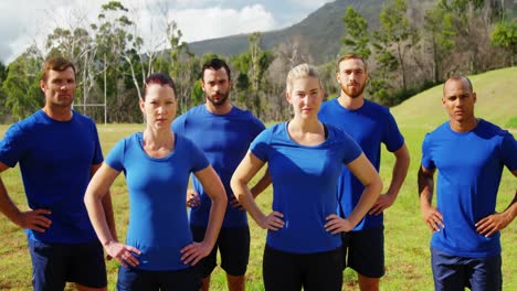 group of people standing with hands on hip in boot camp 4k