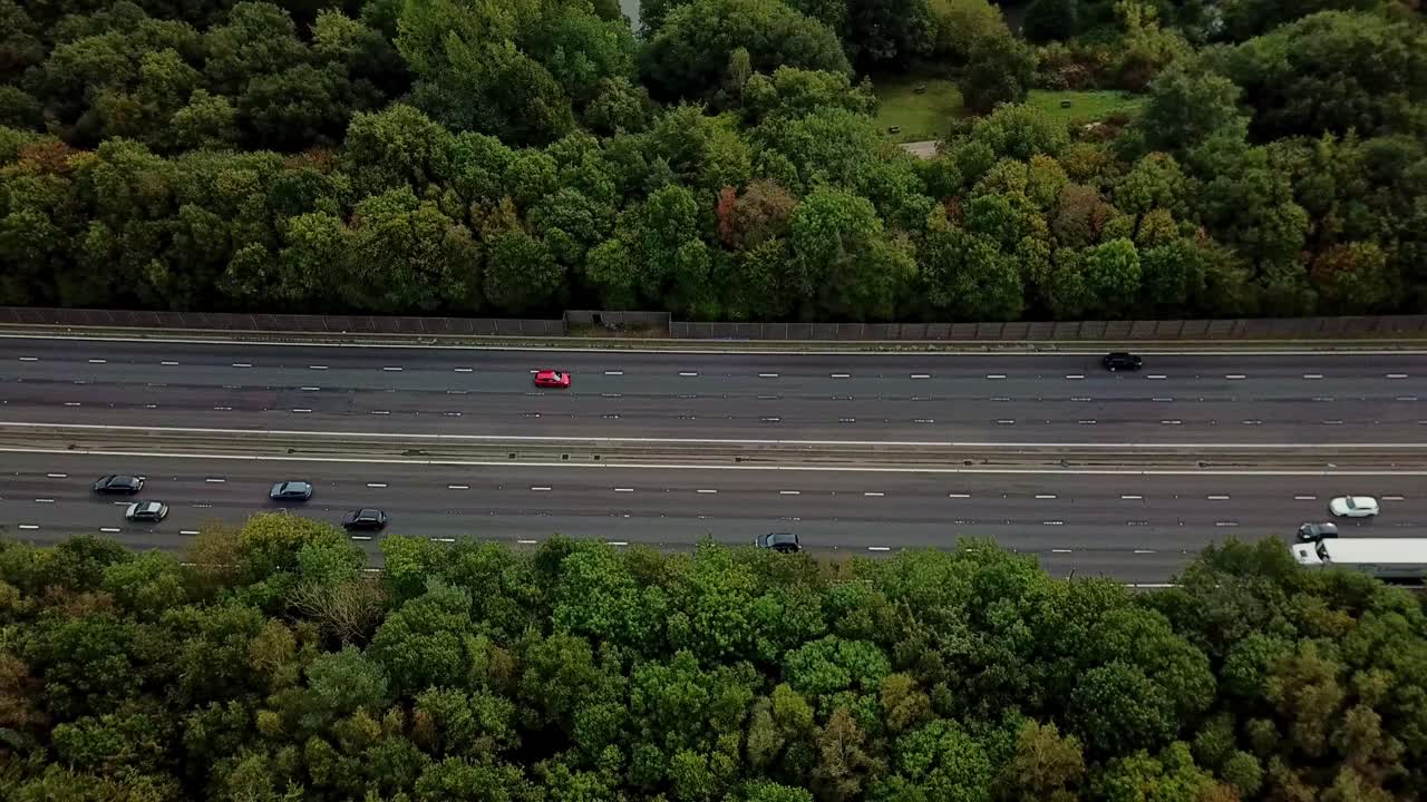 Drone above M1 Motorway with light traffic flying sidways right to left