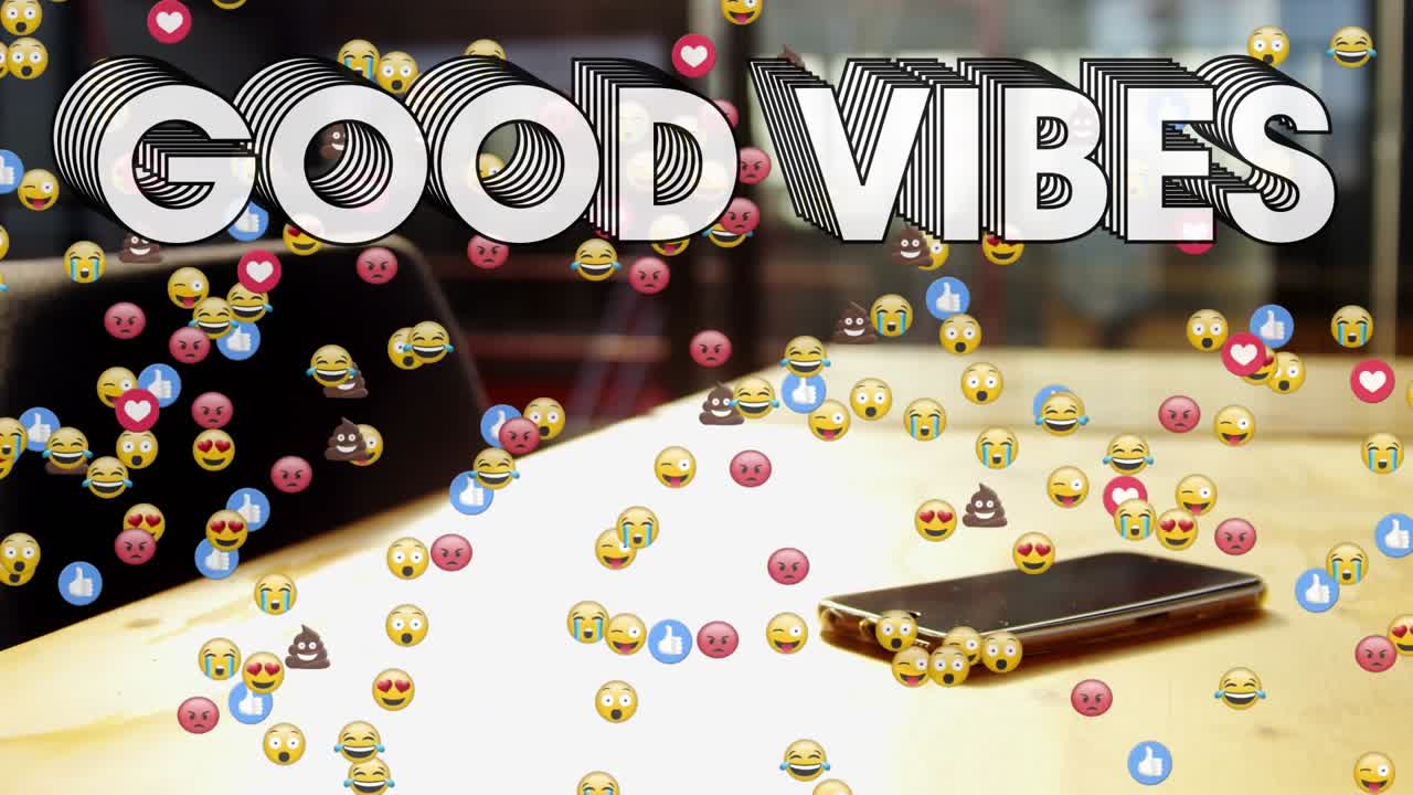 Animazione di un banner di testo "good vibes" ed emoji facciali su uno smartphone su un tavolo di legno.