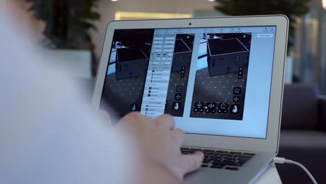 person using laptop for 3d modeling or virtual design