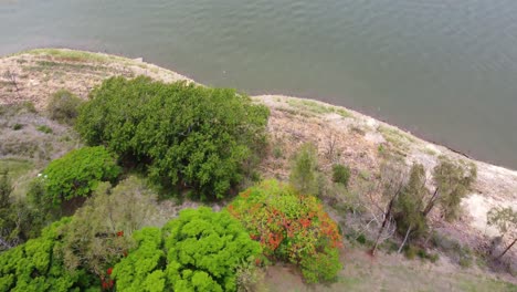 Flying-over-a-road-and-over-a-lake