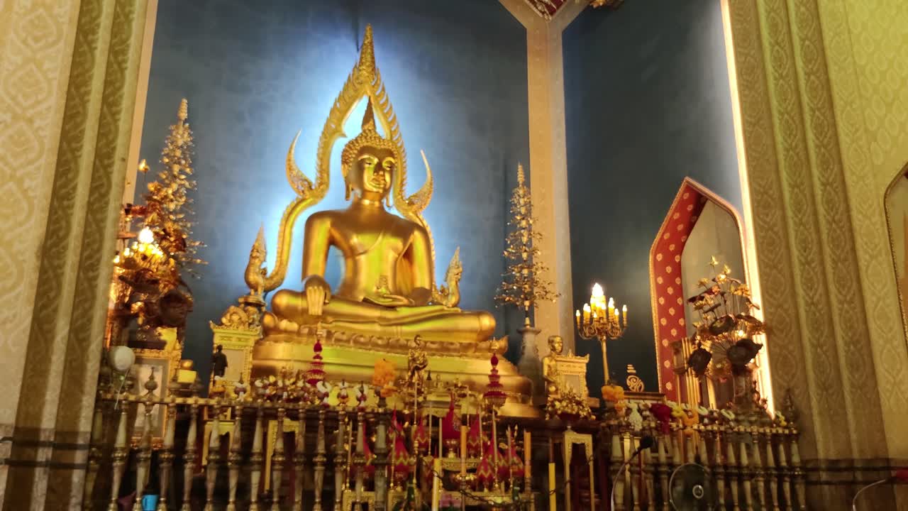 Premium stock video - Elegant golden buddha located inside wat ...