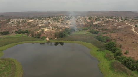 Angola,-Flying-over-a-small-adobe-village,-Caxito,-Bengo,-Africa-3