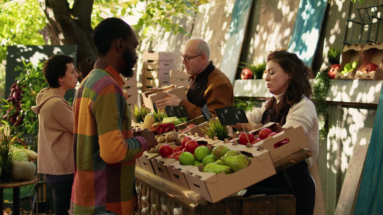 People at an outdoor farmers market