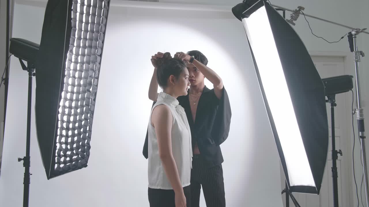 Backstage Of The Photo Shoot: Make-Up Artist Applies Makeup On Beautiful Asian Model