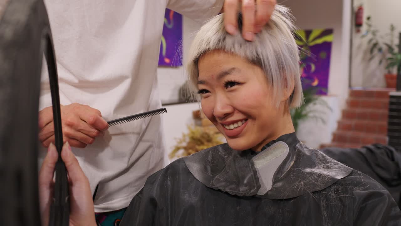Woman Getting a Haircut at a Salon