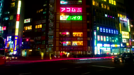 night lapse with many japanese neons at shinjuku south side left panning