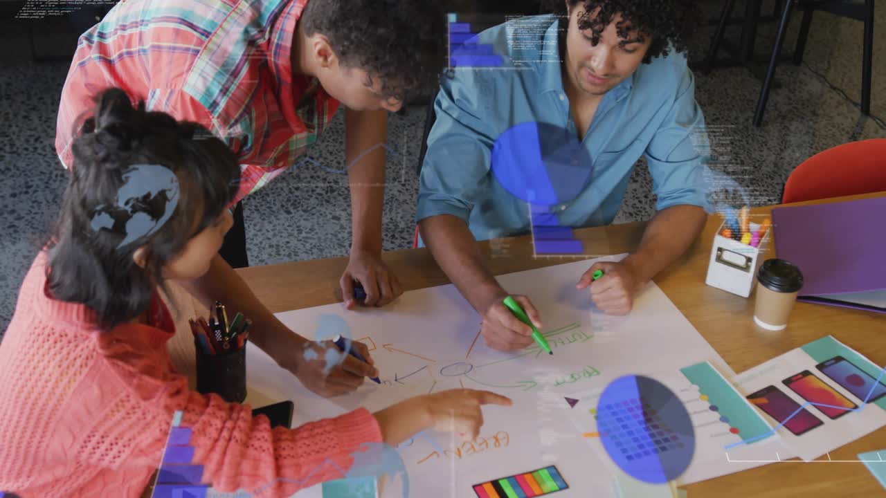 Team at table drawing map while phone tap starting blue overlays showing color swatches for design