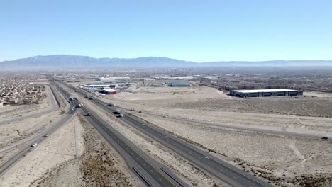 I-40-Interstate-outside-Albuquerque,-New-Mexico-with-traffic-moving-and-stable-wide-shot-drone-video