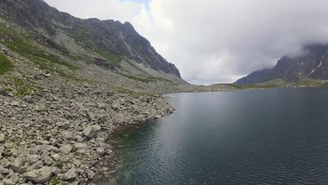 flying an fpv drone over the lakeshore in the high tatras of slovakia