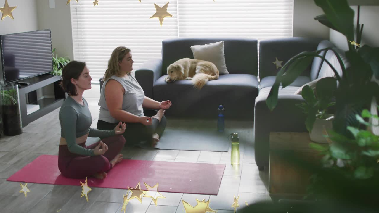 Unrolling yoga mats, two women meditating for focus with golden stars drifting around