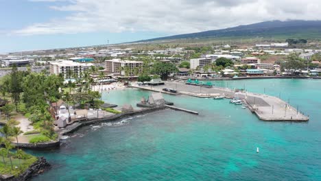 Aerial-close-up-dolly-shot-of-the-ancient-Hawaiian-cultural-site-Kamakahonu-House,-in-Kailua-Kona-on-the-Big-Island-of-Hawai'i