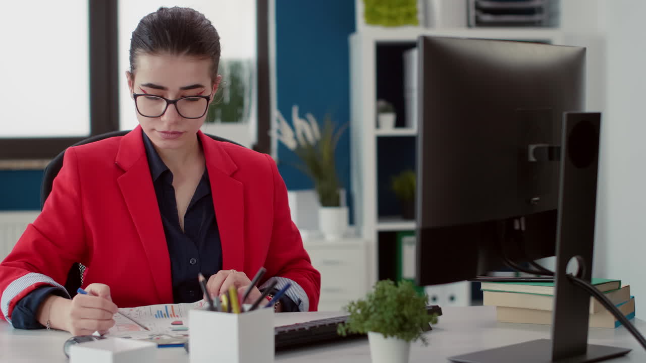 Closeup of african researcher woman looking at leaf slide under microscope
