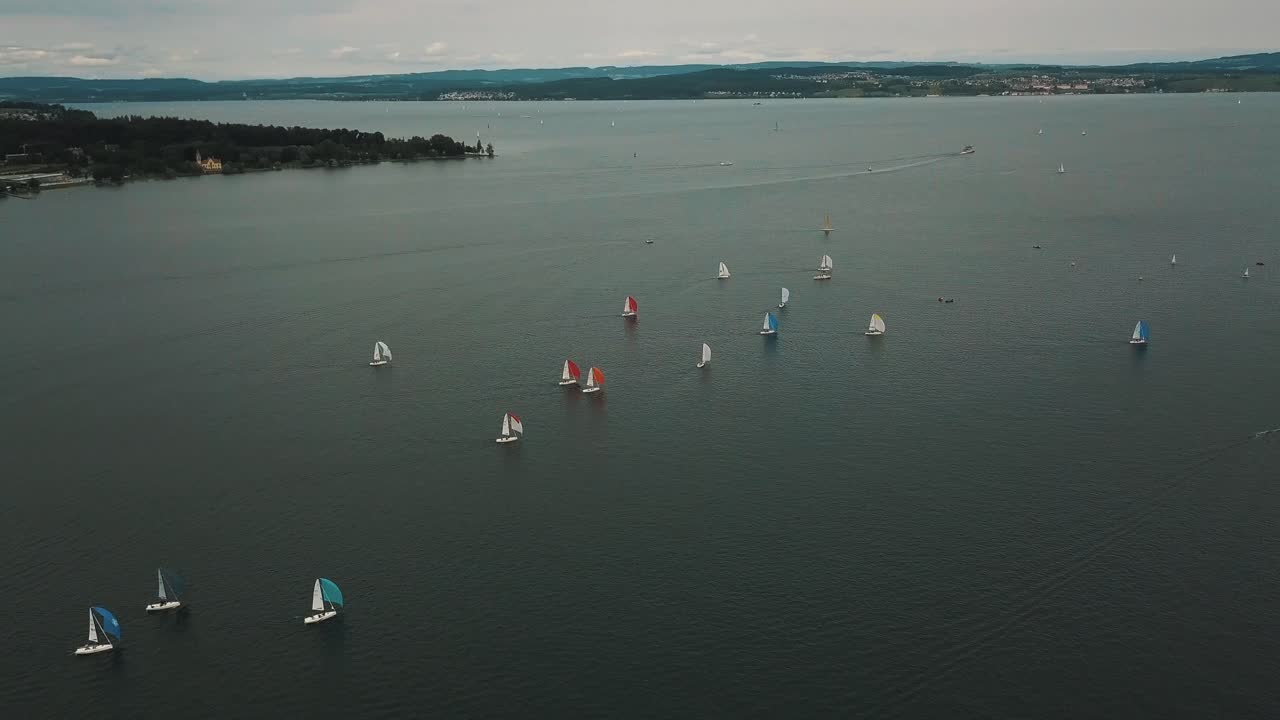 Wind fills the sails of sloops racing in an annual regatta in Germany