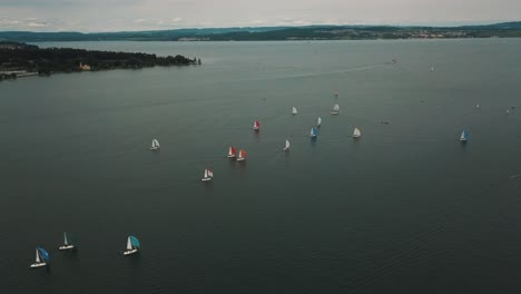 wind fills the sails of sloops racing in an annual regatta in germany