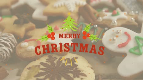 animation of merry christmas text in red with tree and holly sprigs over decorated cookies