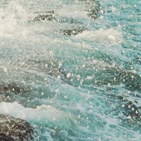 waves are beating on the underwater reefs off the coast. spray of water. slow motion