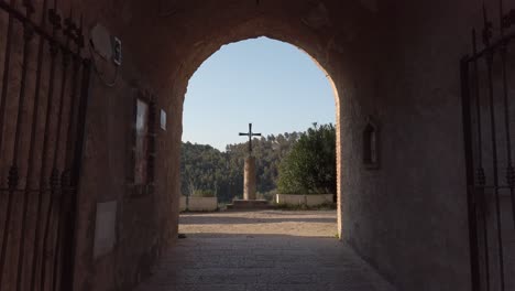 walk towards a christian cross inside a convent